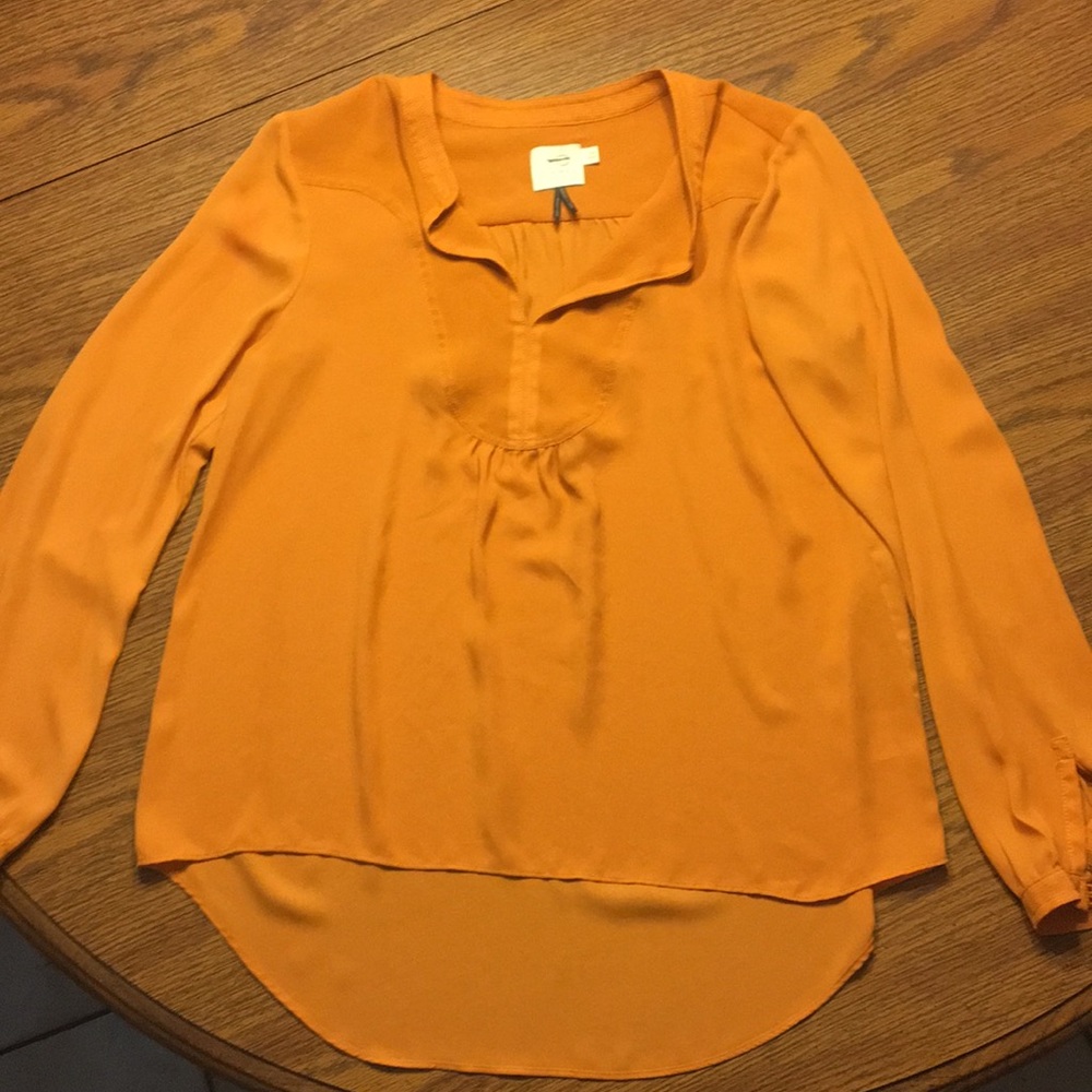 Mustard colored, long sleeve top from HD in Paris